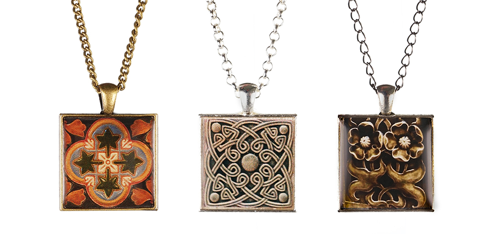 Three square necklace pendants. 